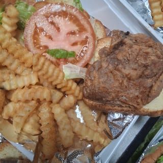 Pork chops sandwich fries , okra, onions rings , taters tots basket